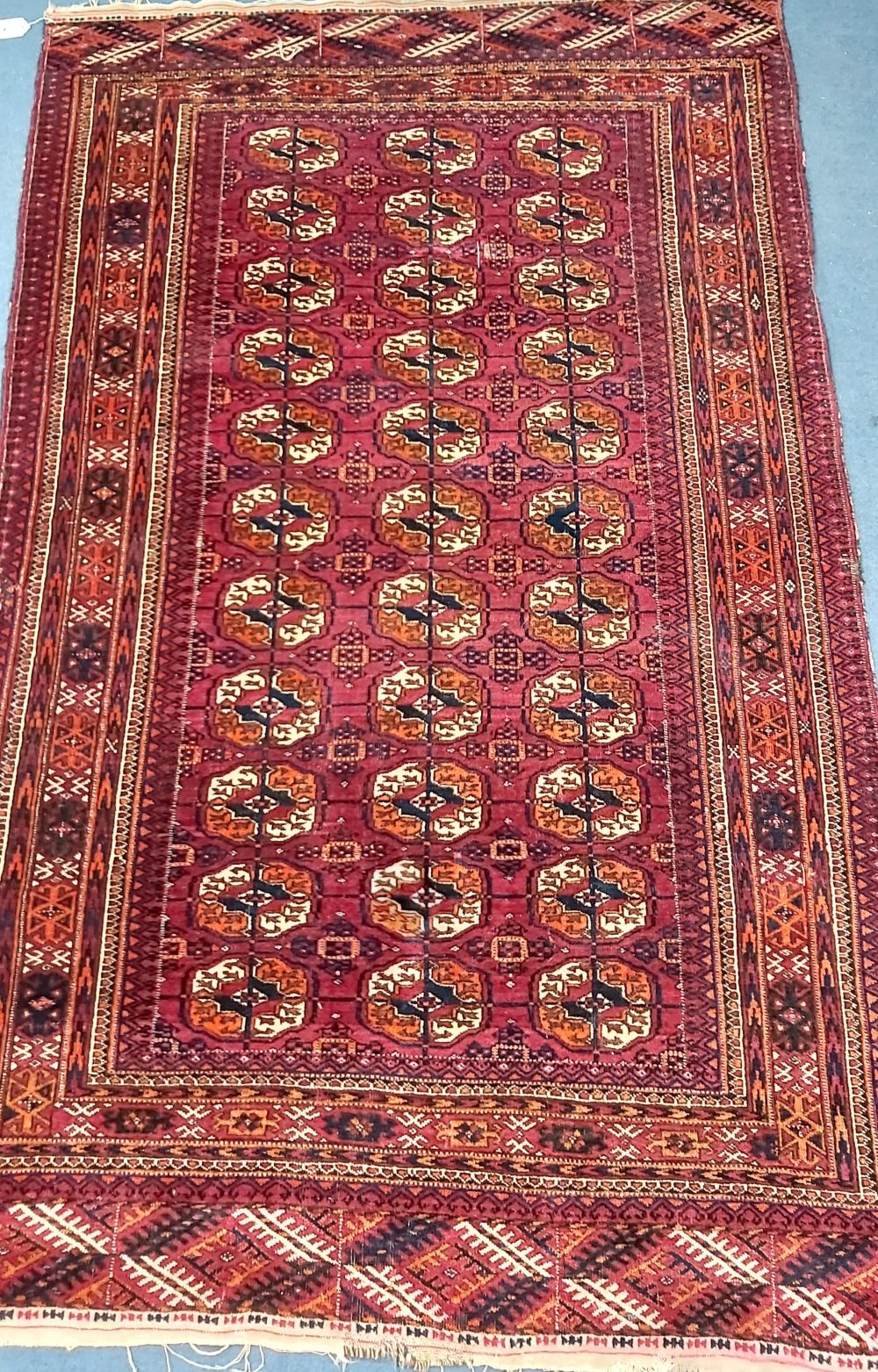 A red ground Bokhara rug, 184 x 118cm